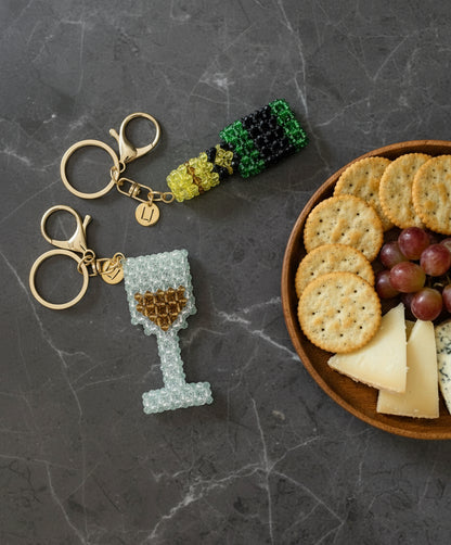 Beaded wine glass and champagne bottle keychains 